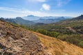 A series of mountains in a blue haze, the mountain landscape of the Karadag reserve in the Crimea. Royalty Free Stock Photo