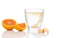 Series of orange flavored vitamin c effervescent tablet dropped and dissolve in glass of water Royalty Free Stock Photo