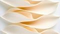 A series of overlapping, curved, and textured shapes in a light peach color.