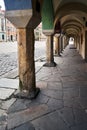 A series of stone columns in the arcades of historic tenement houses Royalty Free Stock Photo