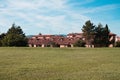 A series of terraced house roofs below a lawn in the italian countryside Gubbio, Umbria, Italy