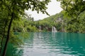 A series of waterfalls flowing into a lake at Plitvice Lakes, Croatia Royalty Free Stock Photo