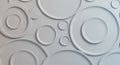 A series of white, circular, three-dimensional patterns adorns a flat, light-colored surfac Royalty Free Stock Photo