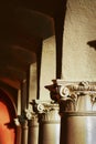 Pillars of a colonnade with shadow and texture