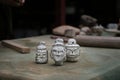 Series of white head-statue handcrafted by an artisan in clay, traditional Asian