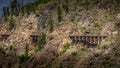 Series of Wooden Trestle Bridges of the abandoned Kettle Valley Railway viewed from across Myra Canyon Royalty Free Stock Photo