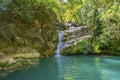 Beautiful woman is showering in the hidden waterfalls of Serik region in Antalya