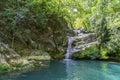 Beautiful woman is showering in the hidden waterfalls of Serik region in Antalya