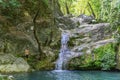 Beautiful woman is showering in the hidden waterfalls of Serik region in Antalya