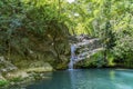 Beautiful woman is showering in the hidden waterfalls of Serik region in Antalya