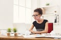 Serious business woman working on laptop at office Royalty Free Stock Photo