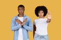 Serious African American man and woman making stop gestures with their hands Royalty Free Stock Photo
