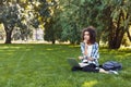 Serious young black woman using laptop in park Royalty Free Stock Photo