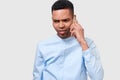 Serious African American young man talking on his smart phone. Upset Afro male have a conversation with his girlfriend. People and Royalty Free Stock Photo