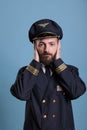 Serious airplane aviator covering ears with hands Royalty Free Stock Photo