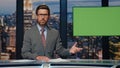 Serious anchor delivering news standing modern studio. Man host saying goodbye Royalty Free Stock Photo