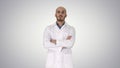 Serious arabian doctor mature male with crossed arms on gradient Royalty Free Stock Photo