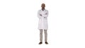 Serious arabian doctor mature male with crossed arms on white background. Royalty Free Stock Photo