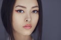 Serious asian beauty woman with creative make-up. Close-up portrait. Royalty Free Stock Photo