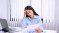 Serious asian business woman Strong headache because working hard and stress from hard work in office Royalty Free Stock Photo