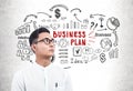 Serious Asian businessman, business plan sketch Royalty Free Stock Photo