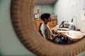 Serious asian guy studying with book while sitting at desk at home Royalty Free Stock Photo