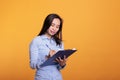 Serious asian woman writing business report on documents Royalty Free Stock Photo