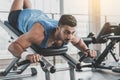 Serious athlete taking exercise in gym Royalty Free Stock Photo