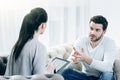 Serious attentive psychologist listening to her patient