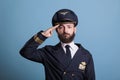 Serious aviation academy airplane pilot saluting