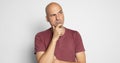 Serious bald man is thinking looking up to copy space isolated Royalty Free Stock Photo