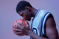 Serious basketball player with ball in studio Royalty Free Stock Photo