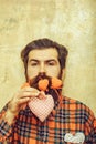 Serious bearded man with heart on long beard Royalty Free Stock Photo