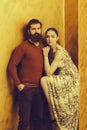 Serious bearded man and pretty girl with raised sexi leg Royalty Free Stock Photo