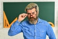 Serious bearded teacher in glasses. back to school. develop logic and creativity. start the brain engine. physics Royalty Free Stock Photo