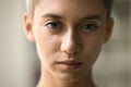 Serious beautiful face of young teenage girl with short haircut Royalty Free Stock Photo