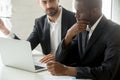 Serious black businessman thinking over business offer looking a