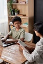 Schoolboy listening to tutor Royalty Free Stock Photo