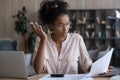 Serious Black woman reading wrong financial papers Royalty Free Stock Photo