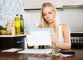 Serious blonde girl with money and documents Royalty Free Stock Photo