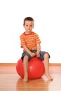 Serious boy with gymnastic ball Royalty Free Stock Photo