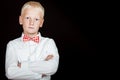 Serious boy with red dotted bow tie starring Royalty Free Stock Photo