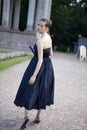 Serious bride in dark blue dress