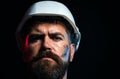 Serious builder in hardhat. Foreman or repairman in safety helmet. Construction worker in hard hat. Bearded man in Royalty Free Stock Photo