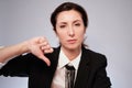 Lady in black jacket making negative gesture looking at camera Royalty Free Stock Photo
