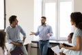 Serious business leader man talking to diverse group of employees Royalty Free Stock Photo