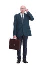 serious business man with a leather briefcase looking at you. Royalty Free Stock Photo