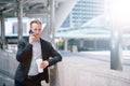 Serious business man talking on cell phone at modern city. Royalty Free Stock Photo