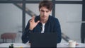 Serious business man talking on video conference. Focused man explaining project Royalty Free Stock Photo