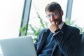 serious business man using his laptop in the airport lounge. Royalty Free Stock Photo